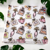 Serviette visage lavable motif parfum Serviette visage lavable en bambou et coton imprimé motif flacons de parfum, fabriquée en France par Atelier Julac
