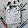 bavoir-tablier-maternelle-bambou-voyage Tablier bavoir en éponge de bambou motif avion et éléphant pour la maternelle - Atelier Julac