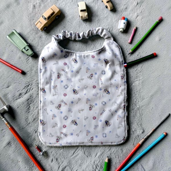 bavoir-tablier-maternelle-bambou-voyage Tablier bavoir en éponge de bambou motif avion et éléphant pour la maternelle - Atelier Julac