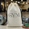 Sac de rangement sport Gym en coton écru Sac de rangement sport en coton écru imprimé Gym, cordon noir, entre deux haltères, MOONLAC chez Atelier Julac